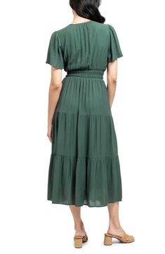 A split neck and short sleeves frame this tiered midi dress that is finished with a flattering smocked waist. 50.625" length (size Small) Split neck Short sleeves Lined 80% rayon, 20% nylon Hand wash, dry flat Imported Model stats: 5'10", 32" bust, 25" waist, 36" hip. Model is wearing size Small. Fitted Waist Short Sleeve Maxi Dress For Summer, Vacation Smocked Midi Dress With Ruffle Hem, Vacation Midi Smocked Dress With Ruffle Hem, Summer Short Sleeve Midi Dress With Ruffles, Summer Midi-length Short Sleeve Dress With Ruffles, Midi Smocked Dress With Ruffle Hem For Vacation, Summer Midi Short Sleeve Dress With Ruffles, Casual Short Sleeve Midi Dress With Ruffle Hem, Spring Midi Dress With Fitted Waist And Short Sleeves