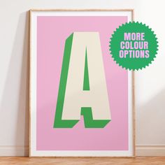 a pink and green poster with the letter a on it