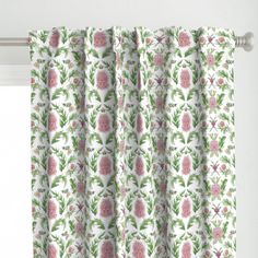 a curtain with pink flowers and green leaves on it