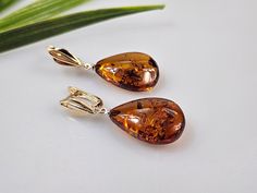 Brown Amber earrings. Not pressed but natural gemstone. Each earrings are teardrop shape. Each earrings can be slightly different due amber is being natural and each is handmade. Total length about 4,5 cm. Set contains: one pair of earrings and extra tops which you can change when needed (gold color and ailver ear wire and lever back and atud in). Due to amber being natural, each of my jewelry is unique and even the same models can be slightly different. Please contact me for more details, photo Elegant Brown Teardrop Earrings For Gift, Hypoallergenic Amber Teardrop Jewelry, Teardrop Baltic Amber Earrings, Amber Teardrop Earrings As A Gift, Amber Teardrop Earrings Gift, Amber Teardrop Drop Earrings For Gift, Hypoallergenic Amber Teardrop Earrings, Formal Brown Teardrop Earrings, Brown Teardrop Earrings For Formal Occasions