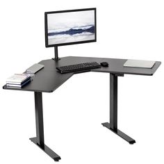 a computer desk with a monitor, keyboard and mouse on it in front of a white background