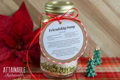 a jar filled with food sitting on top of a table next to a christmas tree