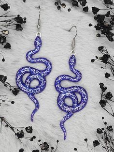 Handmade Purple Rainbow Glitter Snake Dangle Resin Earrings with Hypoallergenic Stainless-Steel Ear Hooks. (Ear Hook Options)  Stainless Steel Hooks in stainless steel color Hypoallergenic Plastic Hooks in color to best suit and complement the earrings. (Recommended for metal allergies and extreme sensitivities) (Additional Cost Will Be Applied) All metals used in our Jewelry are labeled nickel free on the packaging we purchase. I offer a wide range of ear hooks in my shop including but not limi Purple Earrings For Halloween Party, Novelty Purple Jewelry For Party, Novelty Purple Party Jewelry, Novelty Purple Earrings For Party, Purple Novelty Earrings For Party, Purple Glitter Party Jewelry, Purple Earrings As Halloween Gift, Purple Earrings For Halloween Gift, Handmade Purple Halloween Earrings