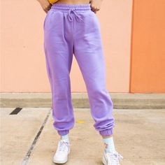 Lounge Wear But Make It Colorful! The Clemetine Sweatpants Are As Soft And Cozy As It Gets. The Perfect Pants For Running Errands, Lounging Around, Or For An Athleisure Look. Seen Paired With The Clear As Day Lounge Tank And The Checkered Daisy Socks. True To Size. 53% Cotton 45% Polyester 2% Spandex Model Is 5'7 Wearing Size. Trendy High Waist Cotton Joggers, Trendy High-waist Cotton Joggers, Purple Tapered Leg Bottoms For Spring, Purple Straight Leg Pants With Elastic Waistband, Purple Ankle-length Pants With Elastic Waistband, Purple Trousers With Elastic Waistband, Ankle-length Purple Pants With Elastic Waistband, Purple Elastic Waist Ankle Pants, Purple Full-length Bottoms With Elastic Waistband