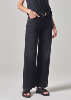 This trouser inspired silhouette is designed to sit high on the waist with a flattering, ultra-relaxed wide-leg. This easy-going staple offers a full length 30” inseam. Style yours with a sleek bodysuit or a classic t-shirt and blazer. For extra length, try the Annina Long 33”. This fit is true to size. Looks Like: Saturated blackFeels Like: Midweight non stretch organic cotton From our HUMANITY Collection Easy Going, Citizens Of Humanity, Trouser Jeans, Classic T Shirts, Full Length, Wide Leg, High Rise, Organic Cotton, Sleek