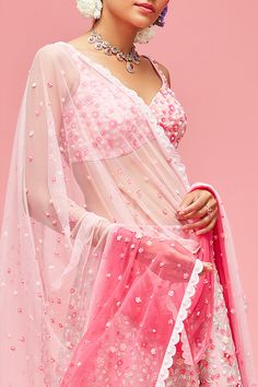 Editor's Note Rose Pink Nishat Bagh Embroidered Ombré Lehenga With Blouse And Dupatta Color: Pink Fabric: Lehenga & Blouse: Organza; Lining: Shantung; Dupatta: Tulle Care: Dry Clean Only About the Designer Nachiket Barve is an award-winning Fashion and Costume designer based in Mumbai, India. He is known for his eponymous label that celebrates Indian tradition with a contemporary and global outlook. Blouse Organza, Embroidered Lehenga, Lehenga Blouse, Costume Designer, Mumbai India, Baddie Quotes, Pink Fabric, Rose Pink, Mumbai