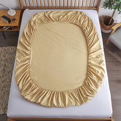 an overhead view of a bed with a comforter on it