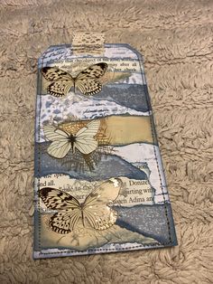 a cell phone case with butterflies on it