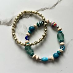 This Stack Includes Multi-Toned Blue Evil Eye Bracelet And A Gold Stacker. 7” But Can Be Adjusted Upon Request Ready To Ship! Blue Evil Eye Bracelet, Tiffany And Co Bracelet, Stretchy Beaded Bracelet, Twisted Bangle, Faux Pearl Bracelet, Gems Bracelet, Wide Cuff Bracelets, Small Bracelets, Bangle Bracelet Set