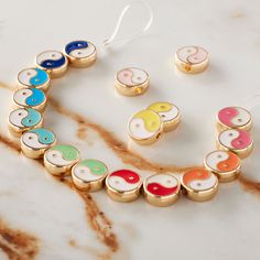 a necklace and earring set on a marble surface