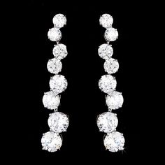 CZ Wedding Earrings e5107These cz earrings are sure to add sparkle to your bridal look. The silver plated design is accented with graduated clear cz crystals.Size: 1 3/4" Long.Color: Silver/Clear.Style: e5107.Please allow 1 week for delivery.Shipping Policy.Return Policy Flower Girl Jewelry Set, Prom Jewelry Sets, Bridal Jewelry Pearl Sets, Crystal Bridal Jewelry Sets, Earring Bridal, Beige Earrings, Flower Girl Jewelry, Formal Earrings, Crystal Wedding Jewelry