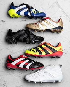 five different types of soccer shoes lined up in a row