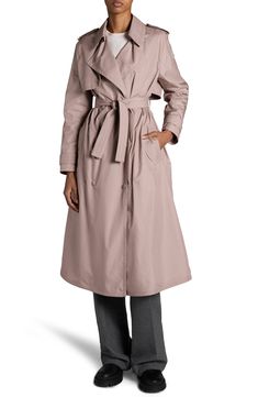 Discreet snaps streamline this classic trench coat that's designed with polished epaulets and Moncler's signature bell logo branding the sleeve. Front snap closure Notched lapels Front welt pockets Storm flap Removable tie belt 100% polyester Dry clean or machine wash, dry flat Imported Designer Clothing Chic Raincoat For Workwear, Elegant Long Raincoat For Fall, Elegant Long Fall Raincoat, Elegant Solid Color Raincoat For Work, Designer Gabardine Outerwear, Elegant Solid Raincoat For Work, Elegant Raincoat For Workwear, Elegant Fall Raincoat, Elegant Solid Color Fall Raincoat