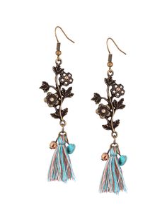 PRICES MAY VARY. VINTAGE BLOSSOM DESIGN: These earrings present a romantic floral motif, intricately detailed and adorned with sparkling crystal elements, evoking the charm of antique jewelry. PLAYFUL TASSEL EMBELLISHMENT: Muted-tone tassels drape gracefully, complemented by bright beads, adding a bohemian flair and dynamic movement to these dangle earrings. RICH ANTIQUE PATINA: The earrings' bronze-tone finish enhances the depth of the design, providing a look of timeless elegance reminiscent o Earrings Bronze, Dynamic Movement, Indie Jewelry, Turquoise Boho, Vintage Hippie, Blossom Design, Hippie Jewelry, French Wire, Antique Earrings