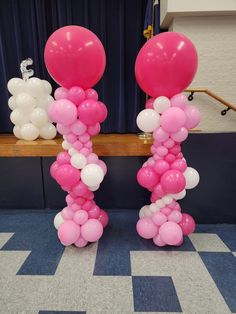 pink and white balloons in the shape of letters