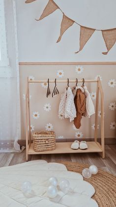 Looking for a wonderful storage option for kids? Our teepee clothes rack is an amazing way to accentuate a particular part of a playroom, nursery, or any other space. The reason why the Montessori kids wardrobe is ideal for little fashionistas is that it has a hang bar at the top and a shelf at the bottom. You can easily hang up the clothes of your little ones, place storage baskets, and add a bit of style and comfort to the room.  Made of the highest quality birch plywood, the clothes rack for baby is environment-friendly and safe for your little cherub. Simple wooden children's clothing rack is a perfect tool for parents looking for ways to promote self-independence in kids. Besides, the rack will become your personal helper when it's time to start encouraging the child to (un)dress them Bany And Kids Clothing Range, Baby Clothes On Shelf, Baby Clothes Hanging Shelf, Montessori Bedroom Clothes Storage, Nursery Shelves Clothes, Ikea Clothes Rack Nursery, Nursery Closet Change Table, No Closet Toddler Room, Montessori Toddler Wardrobe Ikea