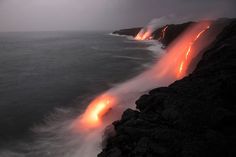 lava pouring out of the ocean into the air