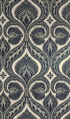 an intricate blue and white wallpaper pattern