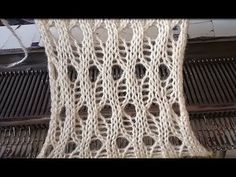 a close up of a piece of cloth on top of an oven grates and wires