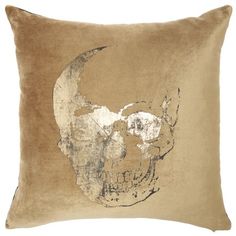 a brown pillow with a skull on it