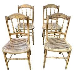 four chairs with cane back and wicker seats