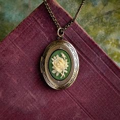 Rose Flower Stem Cameo Oval Vintage Style Brass Locket - Etsy Vintage Flower Pendant Locket Necklace, Vintage Flower Jewelry Keepsake, Handmade Oval Brass Locket Necklace, Vintage Charm Oval Locket Necklace, Vintage Oval Locket Necklace With Charm, Vintage Oval Keepsake Locket Necklace, Vintage Pressed Flowers Jewelry Keepsake, Vintage Pressed Flowers Keepsake Jewelry, Oval Vintage Locket Necklace