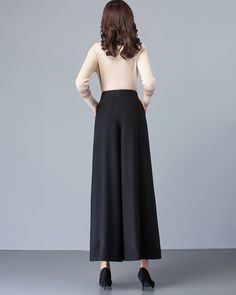 * A simple wide leg pants for winter, made of quality wool blends. * Two pockets, they are big enough for Iphone and your hands. * Fixed waist with zipper and button. * Material: 50% wool, 50% polyester; lining-100% polyester * Washing instructions: Dry Clean Only * Let us know your usual size in your country and your overall height. * Can custom make waist size and length. * Size: True to US size, US 0-US 20 are available, you can let us know your usual size and height in your order. * Shipping Baggy Black Full-length Dress Pants, Solid Wide Leg Winter Pants, Solid Color Wide Leg Winter Pants, Winter High Waist Wide Leg Pants With Pockets, High Waist Wide Leg Pants With Pockets For Winter, Winter Solid Full-length Bottoms, Elegant Loose Fit Bottoms For Fall, Winter Wide Leg Workwear Pants In Solid Color, High Waist Dress Pants With Pockets For Winter