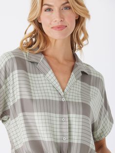 The Sheena Woven Button Up is crafted from 100% sustainable lenzing viscose for guilt-free fashion. It features a drop shoulder design and tie front detail, adding an elevated and stylish touch to any outfit. Rayon V-neck Blouse For Loungewear, V-neck Rayon Blouse For Loungewear, Relaxed Fit Viscose Blouse For Loungewear, Rayon Short Sleeve Tops For Loungewear, Casual Viscose Tops With Button Closure, Casual Button-up Viscose Tops, Summer Viscose Button-up Tops, Summer Button-up Viscose Tops, Viscose Button-up Summer Tops