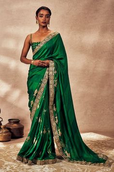 Green saree with embroidered border, embroidered fish motifs on the pallu and mystic foil on vertical stripes. Comes with a foil print blouse piece. - Aza Fashions Pre-draped Slub Silk Saree With Embroidered Border, Festive Green Pre-draped Saree With Embroidered Border, Designer Gold Pre-draped Saree With Embroidered Border, Gold Saree With Embroidered Border For Reception, Elegant Gold Pre-draped Saree With Embroidered Border, Green Banarasi Silk Saree With Embroidered Border, Green Embroidered Border Saree For Reception, Green Pre-draped Saree With Embroidered Border For Festivals, Festive Green Saree With Embroidered Border