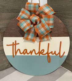 a wooden sign that says, thank you with a bow on it and the word grateful written in large letters