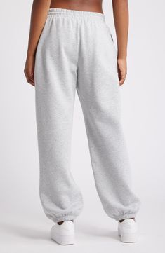 Get into cozy mode with these oversized sweatpants made with soft fleece and the essential elastic waist. Elastic/drawstring waist 68% cotton, 32% polyester Machine wash, tumble dry Imported Not available for sale and shipment to Germany Oversized Casual Sweatpants With Elastic Cuffs, Oversized Solid Joggers With Elastic Waistband, Oversized Comfortable Joggers For Leisure, Sporty Sweats With Elastic Waistband And Relaxed Fit, Cozy Solid Color Bottoms For Streetwear, Cozy Fit Cotton Sweats For Leisure, Sporty Oversized Solid Color Joggers, Comfortable Oversized Joggers For Leisure, Cozy Bottoms For Streetwear