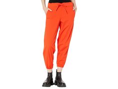 Levi's(r) Womens Off Duty Joggers - Women's Clothing : Comfy Orange Enamel : Boost your chill style wearing the super-comfy and stylish Levi's Womens Off Duty Joggers. Mid-rise, elasticized waist with drawstring closure. Elasticized cuffs. Tapered leg. Front slant pockets and back patch pockets. 59% cotton, 38% viscose, 3% elastane. Machine wash, tumble dry. Imported. Measurements: Waist Measurement: 28 in Outseam: 35 in Inseam: 25 in Front Rise: 10 in Back Rise: 13 in Leg Opening: 10 in Product Fall Utility Sweatpants With Elastic Waistband, Trendy Leisure Pants With Elastic Cuffs, Utility Style Relaxed Fit Joggers With Drawstring, Relaxed Fit Utility Joggers With Drawstring, Utility Relaxed Fit Joggers For Loungewear, Relaxed Fit Utility Joggers For Loungewear, Spring Utility Sweatpants With Relaxed Fit, Spring Utility Style Relaxed Fit Sweatpants, Sporty Relaxed Fit Parachute Pants For Fall