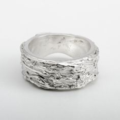 This "Fiji" silver ring is handmade in Fine Silver (99.9% pure silver). This unique piece is entirely molded by hand, using the silver clay technique. The style of this ring is inspired by the beauty of the most amazing coral reefs in the world. Ring size: 7.25 (This is a unique creation. Only one size available. I cannot adjust the ring size.) What is Fine Silver? Fine Silver, also called Precious Metal Clay or Silver Clay, is a malleable material composed of microscopic particles of pure silver. It is made from silver that is recycled from a range of sources, including waste from x-rays and the photographic industry. It can be worked like traditional clay using the hands, or else molded. The molded piece is then heated to merge the fine silver particles together. The result is a 99.9% pu Carved Sterling Silver Rings For Anniversary, Sterling Silver Carved Promise Ring, Artisan Hand Cast Silver Rings, Anniversary Carved Sterling Silver Ring, Anniversary Sterling Silver Carved Rings, Unique Carved Sterling Silver Rings, Nature-inspired Sterling Silver Jewelry With Lost Wax Casting, Carved White Gold Sterling Silver Jewelry, Artisan White Gold Sterling Silver Rings