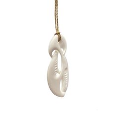 Handmade Maori Unity Twist pendant with with engraved carvings. This Twist has a modern style blending elements from the Hai-Matau and the Koru which represent prosperity, new life and peace. The Twist with its crossing design represents the many paths of life and love, as such is regarded as the original eternity symbol. A single Twist shows the joining together of two people for eternity while the double and triple twists have a similar meaning but refer more to the joining of two peoples or c Symbolic White Medallion Necklace, White Carved Pendant Necklaces, White Carved Pendant Necklace, Artisan Carved White Necklace, White Symbolic Pendant Necklace, Handmade Symbolic White Necklace, Traditional White Carved Necklaces, White Carved Amulet Necklace, Artisan White Engraved Necklace