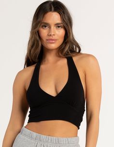 Full Tilt Halter Top. Plunging V-Neckline. Shoulder Straps That Tie Around The Neck. Low Back. Cropped Fit. Fitted Silhouette. 95% Cotton. 5% Spandex. Hand Wash. Imported. Model Is Wearing A Size Small. Model Measurements:height: 5'7.5" Bust: 32"waist: 26"hips: 35" Versatile V-neck Top With Built-in Bra, Versatile V-neck Tops With Built-in Bra, Chic Stretch Low-cut Halter Top, V-neck Bra-friendly Crop Top For Yoga, V-neck Crop Top, Bra Friendly For Yoga, Comfortable V-neck Crop Top For Yoga, Versatile V-neck Crop Top, Stretchy Low-cut Halter Top With Built-in Bra, Stretch Low-cut Halter Top With Built-in Bra