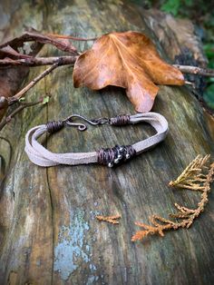 Celtic Leather Bracelet, Ethnic Jewellery  This bracelet is handmade in Ireland.  It is made with genuine, reused Leather and recycled copper wire. The bracelet is one size only - with x cm in length  There is a hook on one end of the bracelet that closes with the other side, made of copper.  The copper does not interact with the skin, in a way that it does not give allergic reactions. On the other hand, it kills microorganisms and bacteria that are on the surface of the skin. Handmade Spiritual Leather Bracelet, Handmade Spiritual Leather Bracelet For Everyday, Everyday Bohemian Nickel Free Wrap Bracelet, Artisan Hand Forged Adjustable Bracelets, Handmade Bohemian Wrap Bracelet With Waxed Cord, Rustic Waxed Cord Bracelets As Gift, Bohemian Hand Forged Adjustable Bracelets, Bohemian Adjustable Hand Forged Bracelets, Bohemian Hand Forged Adjustable Bracelet