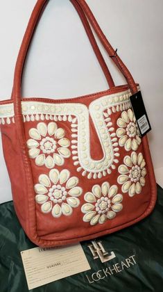 Embroidered Top Handle Shoulder Bag, Embellished Leather Rectangular Shoulder Bag, Chic Embroidered Top Handle Bag, Embroidered Shoulder Bag For Shopping, Elegant Embroidered Tote Satchel, Chic Embroidered Tote Bag, Elegant Embroidered Shoulder Bag With Double Handle, Elegant Embroidered Double Handle Shoulder Bag, Luxury Embroidered Handheld Shoulder Bag