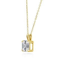 This solitaire pendant necklace promises to be the center of attention with its mesmerizing gold brilliance. Crafted with fine 925 sterling silver, yellow gold flashed, nickel free. The stunning solitaire stone features premium grade 3 carat asscher cut cubic zirconia CZ (8mm) in prong setting. Chain measures 18" in length, 1mm in width. Spring ring clasp. Pendant measures 0.5"(L), 0.3"(W). Get the look of celebrity inspired jewelry. BERRICLE Cubic Zirconia (simulated diamond) jewelry are made w Solitaire Pendant Necklace, Stone Feature, Cz Necklace, Asscher Cut, Solitaire Pendant, Inspired Jewelry, Grade 3, 3 Carat, Wedding Necklace