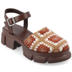 The Dorit platform sandal from Journee Collection showcases a unique and stylish crochet fabric design, adding a touch of eclectic charm to any ensemble. With a comfortable 2- inch platform heel and a 1-inch platform height, these sandals strike a perfect balance between fashion and wearability. The ankle strap with a buckle closure, faux leather lining, and the inclusion of a 4 mm Tru Comfort Foam™ footbed make the Dorit platform sandal not only fashionable but also comfortable for all-day wear