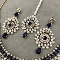 "Indian Sapphire Blue Gold Kundan Necklace Earrings Tikka Hair Jewelry Set, Indian Bridal Jewelry Set, Hindi Choker Pearl Necklace Earrings, Evening Jewelry Set Gorgeous Glowing and sparkling luxury Bollywood inspired jewelry Necklace with studded diamonds and colorful stones, adding a royal touch to complete your look for your special occasion! It would be the perfect jewelry set for you chic brides and your bridesmaids, or any contemporary trendsetter looking for those traditional vibes, but s Traditional Blue Jewelry Sets With Matching Earrings, Hand Set Blue Bridal Earrings As Gift, Hand-set Blue Bridal Earrings As Gift, Traditional Hand Set Blue Bridal Earrings, Traditional Blue Bridal Earrings Hand Set, Traditional Hand-set Blue Bridal Earrings, Traditional Blue Bridal Necklace, Traditional Blue Round Bridal Necklace, Blue Jewelry With Matching Earrings For Festive Occasions