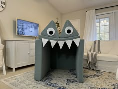 a room with a shark shaped bed in it