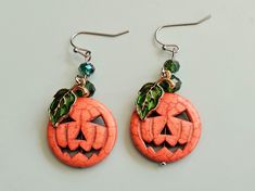 Stone earrings have been dyed orange and decorated with Czech glass beads and enamel leaves to create eye-catching Jack-O'-Lantern earrings.  HYPOALLERGENIC EAR WIRES: Gold-plated or silver-tone surgical steel or silver-tone titanium. MATERIALS USED are tarnish-resistant and durable. JEWELRY CARE QUESTIONS: Geologist here! I have a deeper understanding of most materials used in jewelry. Send ANY questions on materials or jewelry care that you have. CANCELLATIONS: Accepted within 24 hours of purc Lantern Earrings, Earrings For Sensitive Ears, Earrings Hypoallergenic, Earrings Halloween, Witchy Jewelry, Halloween Earrings, Holiday Jewelry, Halloween Jewelry, Hypoallergenic Earrings