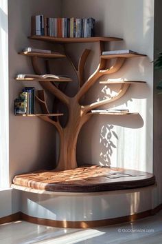 a wooden shelf with books on it next to a tree shaped bookcase in front of a window