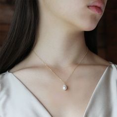 "PERFECT CHRISTMAS GIFT /WEDDING GIFT FOR BRIDE / BRIDESMAID / LADY! You are getting a modern and timeless Swarovski Teardrop Pearl necklace. Swarovski Teardrop Pearl measures 11x8mm. Pearl Color: Crystal White Pearl. I also have Crystal Cream Pearl color available. Model is wearing 16\" necklace measured opened from end to end in Crystal White Pearl color. Prices are in US$. For shipping policies and other important information, click on \"profile\" on the right. See an item that you like but h Pear-shaped Bridal Necklace As Gift, Elegant Teardrop Bridal Necklace As Gift, Bridal Drop Necklace As Gift, White Pear-shaped Bridal Necklace As Gift, White Pear-shaped Bridal Necklace Gift, Pear-shaped White Bridal Necklace Gift, White Teardrop Bridal Necklace As Gift, Dainty Pear-shaped Necklace For Weddings, Dainty Pear Shaped Necklace For Weddings