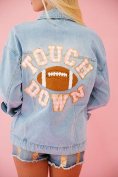 Score a fashion touchdown with our TOUCHDOWN SEASON DENIM JACKET! This denim jacket features mini glam pink striped Touchdown letters and a football patch for a playful and unique look. Stay stylish and cozy all season long! All orders are currently shipping within 14 business days. To receive item quicker, expedited shipping is available at checkout. Homecoming Game Day Outfit, Fall Denim Jacket For College, Football Jean Jacket Girlfriend, Homecoming Jeans, Cheer Fits, Astros Jacket, Custom Jean, 23 Style, Cute Jean Jackets