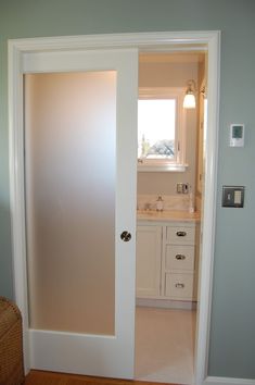 an open door leading to a bathroom in a house