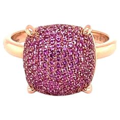 This is a beautiful authentic ring from Tiffany & Co. by designer Paloma Picasso from her Sugar Stacks Collection. It is crafted from 18k rose gold with a polished finish. The top of the ring has a cushion shape bridge with a high dome set with gorgeous pave pink sapphires, the dome is secured by 4 sturdy prongs. The ring is signed by the designer with the gold content. Brand: Tiffany & Co. Hallmark: Tiffany & Co. Au750 Italy Paloma Picasso Pink Sapphires: 0.85ct Measurements: top: 0.50" x 0.50" Luxury Pink Diamond Gemstone Ring, Luxury Pink Sapphire Gemstone Ring, Luxury Pink Gold Ruby Ring, Luxury Pink Diamond Ring With Pink Sapphire, Luxury Pink Sapphire Ring With Pave Setting, Luxury Rose Gold Rings With Accent Stones, Luxury Pink Pink Sapphire Diamond Ring, Luxury Pink Gold Ring With Pink Sapphire, Luxury Pink Rings With Pave Setting