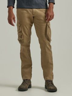 MADE FOR MEN ON THE MOVE Nothing combines comfort and function quite like a cargo. The Wrangler® men's regular tapered cargo pants are the familiar style you know you can count on with a modern leg opening and a stretchy fabrication for even more comfort. The tapered leg's slimmed down style is easy to pair with sneakers and work boots alike. The cargo pants are equipped with nine total pockets: two small stacked flap pockets, a cargo pocket, welt hip flap pockets, slash front pockets, and an ea Tapered Cargo Pants, Wrangler Pants, Western Shop, Workwear Jeans, Mens Workwear, Outdoor Pants, Outdoor Men, Cargo Pocket, Work Wear Women