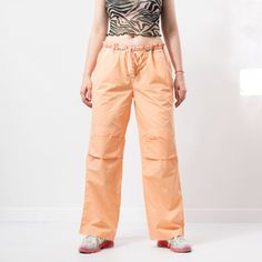 "The light track pants in orange - brand: Danza Fitness - tied waist - 2 pockets - materials: cotton SIZE size from label: XXL MEASUREMENTS waist: 40 inches (102 cm) hips: 44 inches (112 cm) rise: 10.5 inches (27 cm) length: 40.5 inches (103 cm) inseam: 30 inches (76 cm) The model is 5'9\" (174 cm), measures 35-27-38 (89-69-96 cm) and typically wears clothing in size M CONDITION - 8/10 - The pants in great pre-owned condition. Washed, ready to wear." Casual Orange Joggers For Streetwear, Sporty Orange Cotton Sweatpants, Casual Orange Sweatpants With Elastic Waistband, Sporty Orange Bottoms With Drawstring, Orange Relaxed Fit Cotton Sweatpants, Orange Athleisure Pants With Pockets, Orange Cotton Athleisure Bottoms, Spring Athleisure Orange Bottoms, Orange Sweatpants With Pockets For Loungewear