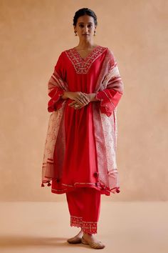 Red chanderi silk kurta featuring gold zardozi and thread embroidery on the neckline and delicate cut work on the sleeves. Paired with an embroidered pant, tribal motif tasseled dupatta and slip.
Components: 4
Pattern: Embroidered
Type Of Work: Zardosi
Neckline: V Neck
Sleeve Type: Long Cutwork
Fabric: Chanderi Silk, Silk Organza
Color: Red
Other Details: 
Kurta length: 44 inches
Model Height: 5ft 9inches, wearing size S
Occasion: Mehendi and Haldi - Aza Fashions Festive Kurta With Dupatta For Rituals, Chanderi Traditional Drape Kurta For Rituals, Traditional Chanderi Kurta For Rituals, Traditional Drape Chanderi Kurta For Rituals, Chanderi Kurta With Dupatta For Rituals, Chanderi Kurta With Zari Work For Rituals, Navratri Chanderi Kurta For Rituals, Eid Kurta With Dupatta For Rituals, Diwali Kurta With Dupatta For Rituals